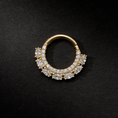 Gold and diamond earring on a black background