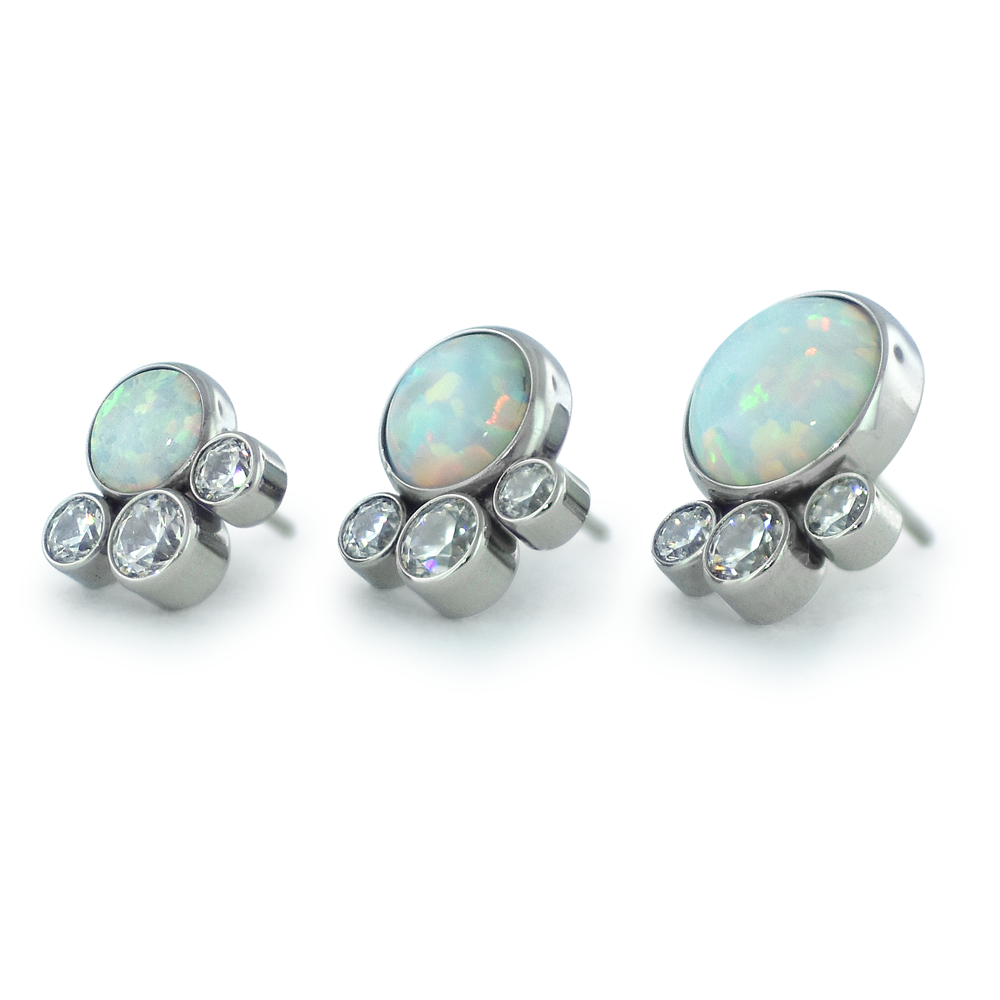 An offset image of 3mm, 4mm, and 5mm Threadless Titanium Bezel Set Cabochon with 1.5mm and 2mm Cubic Zironcia faceted gems underneath.